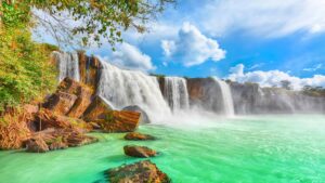 Dray Nur Waterfall in Vietnam's Central Highlands, surrounded by lush nature.