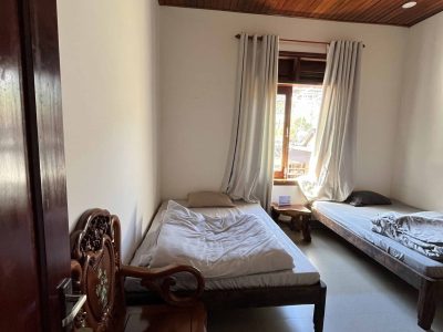 Eco-friendly homestay in Đắk Lắk with garden views, rustic rooms, and local farm experiences at Greentraveller.