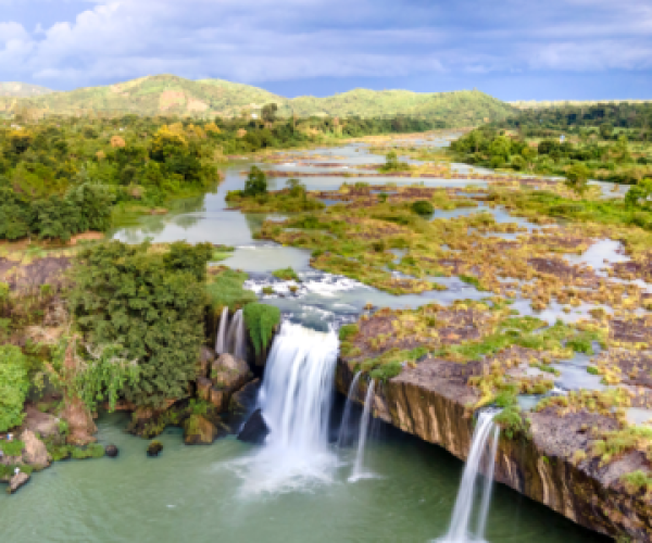 Dray Nur Waterfall in Vietnam's Central Highlands, surrounded by lush nature.
