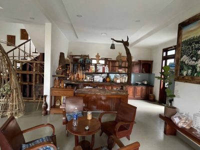Eco-friendly homestay in Đắk Lắk with garden views, rustic rooms, and local farm experiences at Greentraveller.