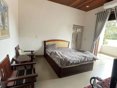 Eco-friendly homestay in Đắk Lắk with garden views, rustic rooms, and local farm experiences at Greentraveller.